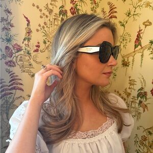 Prada Black Frame White Temples Sunglasses with Gold Hinges